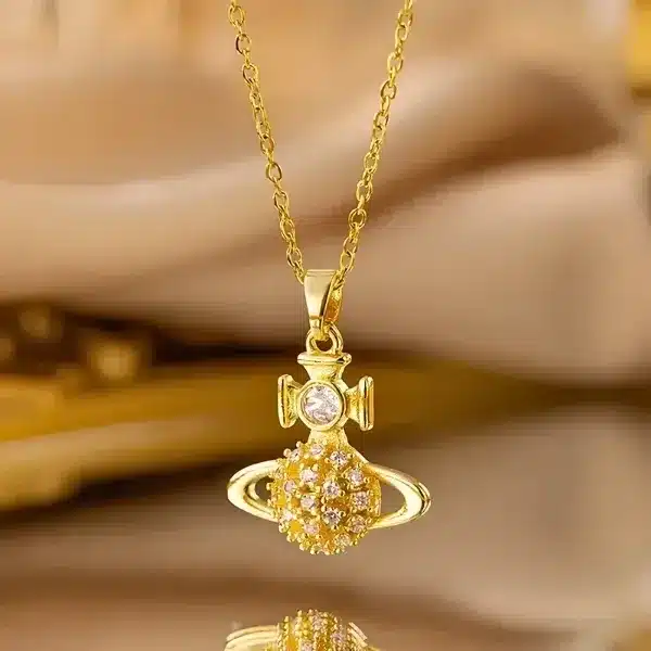 825258-MLV113352467906_072026 Collar Dorado Saturno Estrellas Nana Vivienne Wetswood